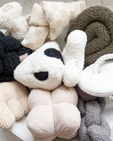 Modern minimalist dog toys. Neutral tone pet toys. 